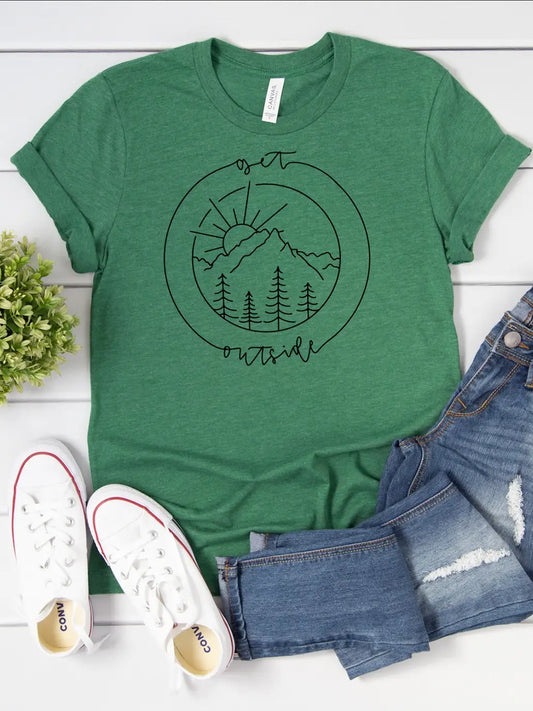 A green t-shirt with the words Get Outside printed on it along with a circular graphic of mountains, trees and the sun.